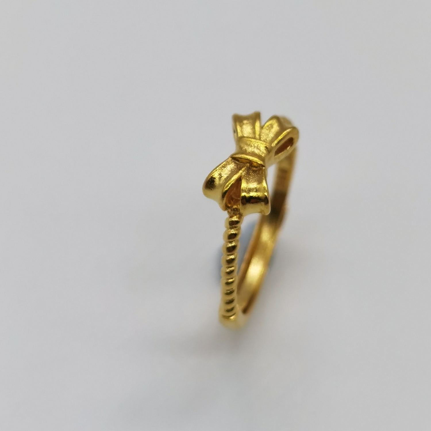 Alluvial gold vacuum electroplating 24K gold bow tie ring