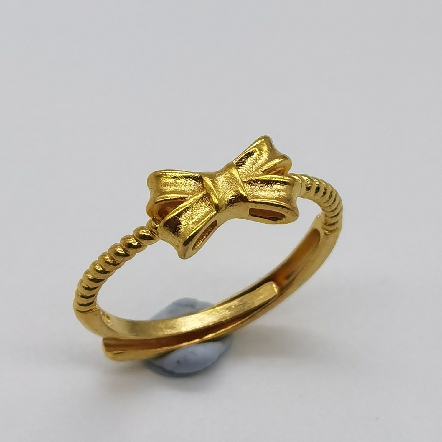 Alluvial gold vacuum electroplating 24K gold bow tie ring
