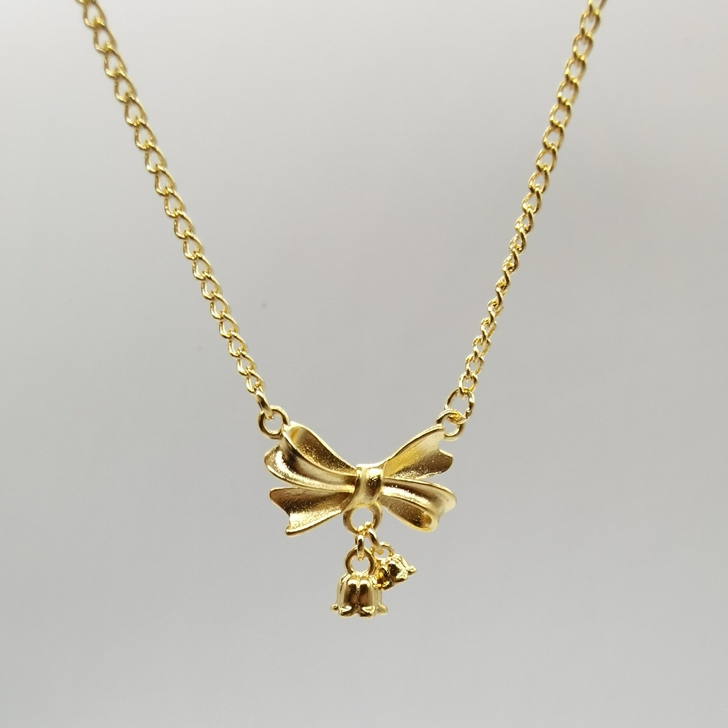 Alluvial gold vacuum electroplating 24K gold lily of the valley bow necklace